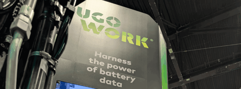 UgoWork trade show booth display with the slogan “Harness the power of battery data” beneath the green UgoWork logo.
