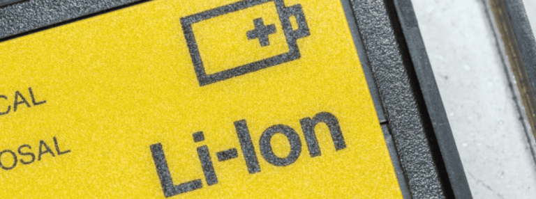 View of a lithium-ion battery with the 'Li-Ion' label, a battery pictogram, and a yellow background.
