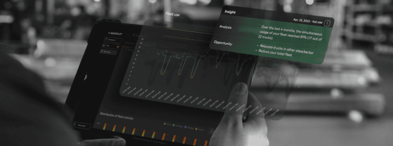 Hand holding a tablet displaying fleet usage analytics in UgoPilot.