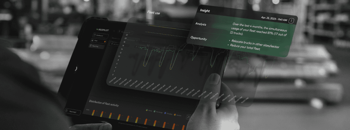 Hand holding a tablet displaying fleet usage analytics in UgoPilot.