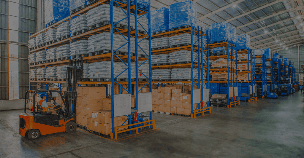 High-capacity lithium-ion forklift batteries in warehouse storage.