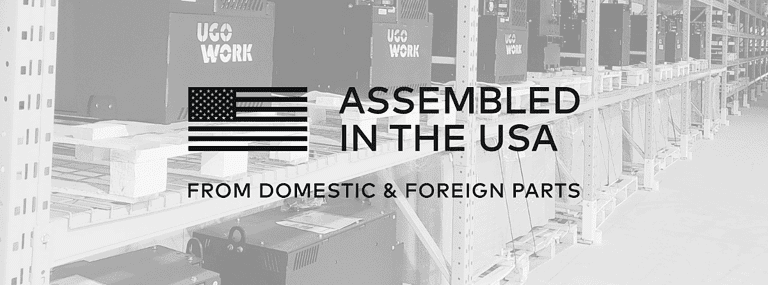 UgoWork batteries in warehouse with text 'Assembled in the USA from domestic & foreign parts' and stylized US flag.