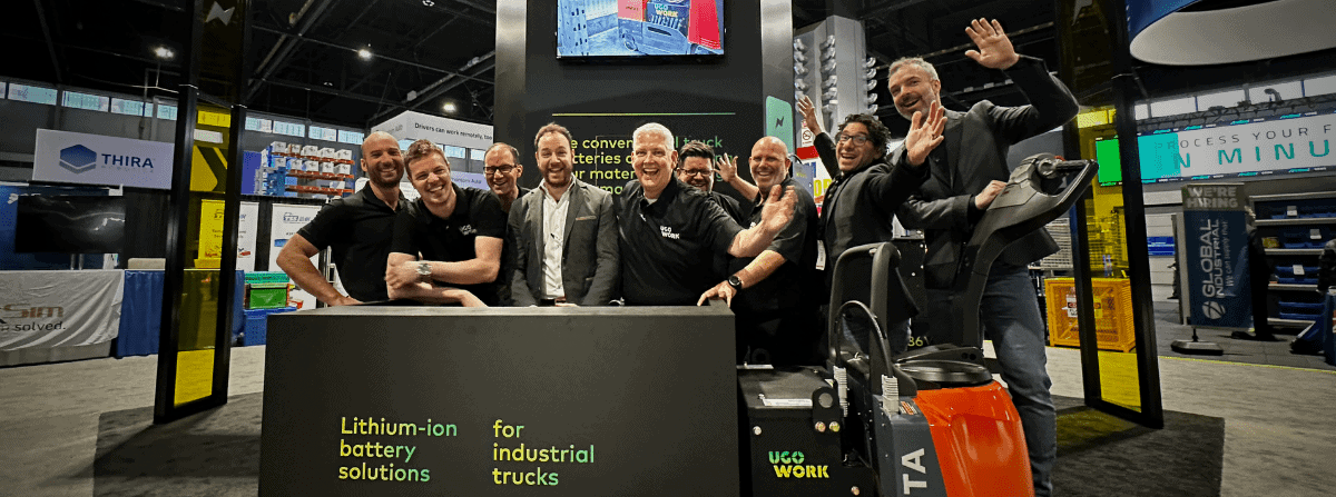 UgoWork's sale team in the ProMat 2023 booth celebrating the closing of the show