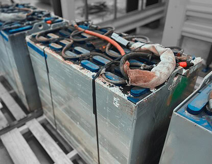 Used forklift lead-acid battery with visible signs of corrosion and leakeages.
